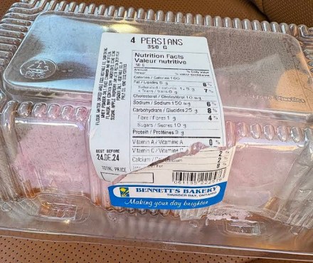 A Persian pastry, complete with pink icing, still in the package